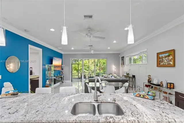 a kitchen with a table chairs and a stove