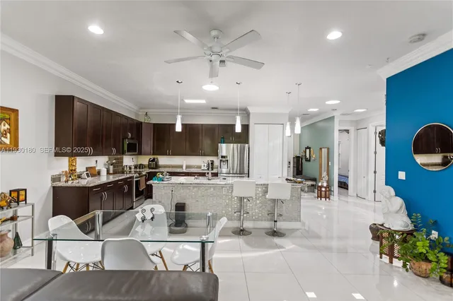 a living room with furniture and large windows