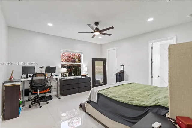 a bedroom with a bed and a desk