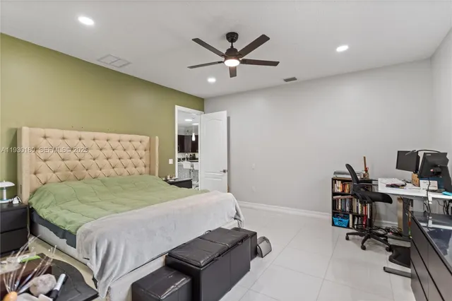 a spacious bathroom with a double vanity sink a mirror and a