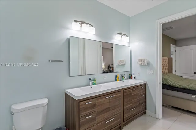 a bathroom with a toilet and shower