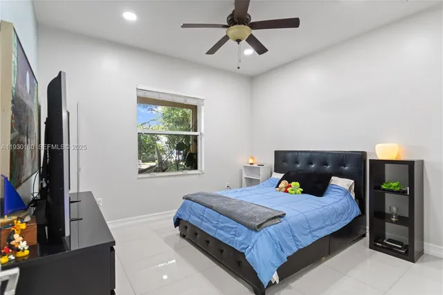 a bedroom with bed and window