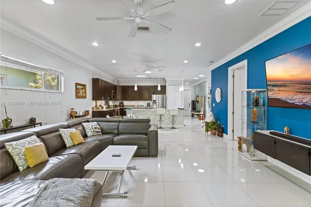 a living room with furniture and a flat screen tv