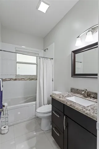 a bedroom with a bed and furniture