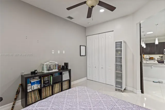a bedroom with a bed and a book shelf
