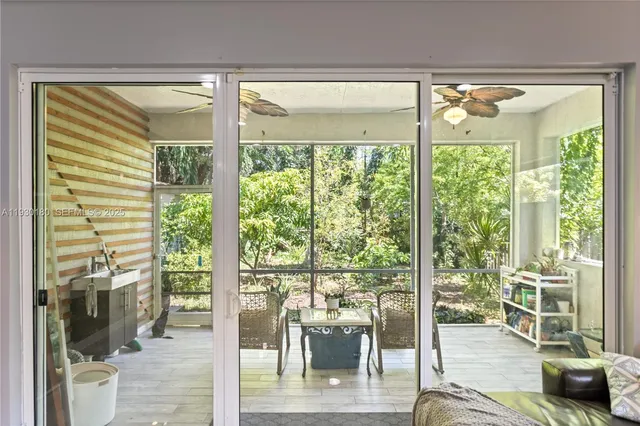 a living room with large windows