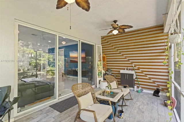 a view of a glass door with a tree