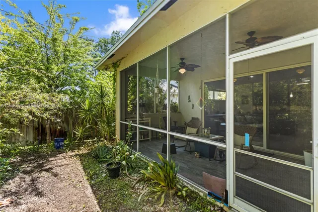 a backyard of a house with lots of green space and garden view