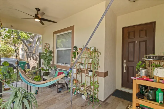 a front view of a house with outdoor seating