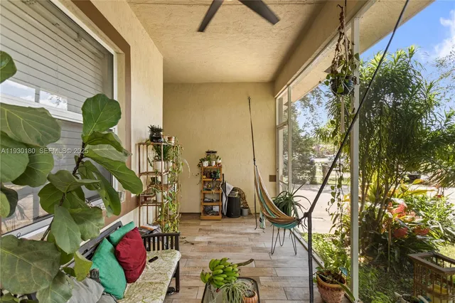 a lobby with furniture and a potted plant