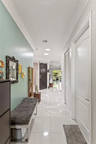 a kitchen with a sink a counter top space appliances and cabinets
