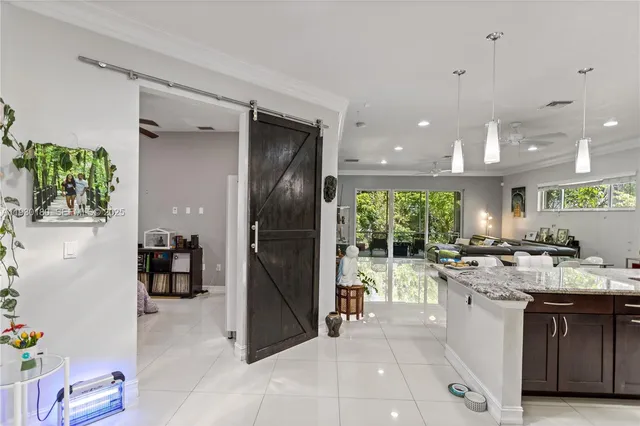 a kitchen with lots of counter top space and stainless steel appliances