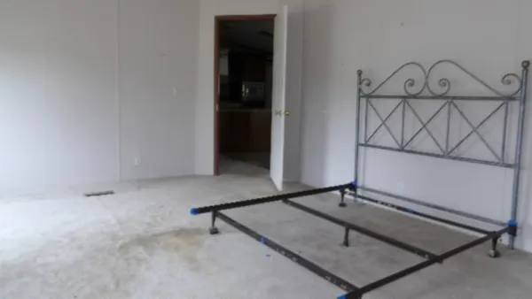 a room with a table and mirror