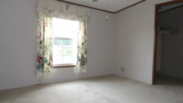 a view of an empty room and window