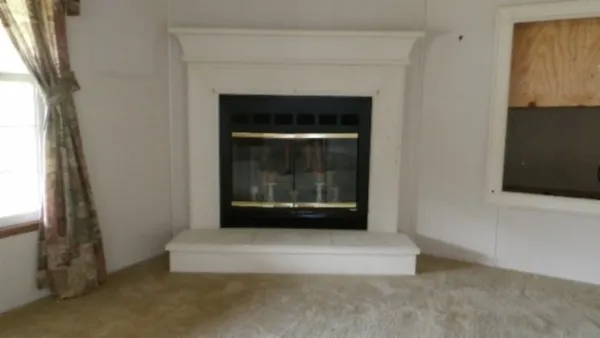 a kitchen with a refrigerator and cabinets