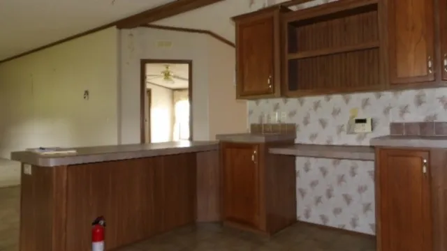 a kitchen with a sink and a window