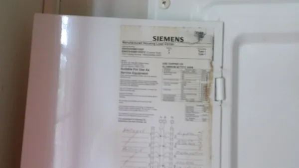 a view of a field with trees in the background