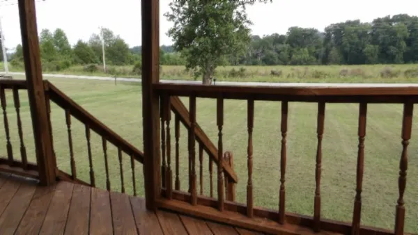 a view of balcony and yard