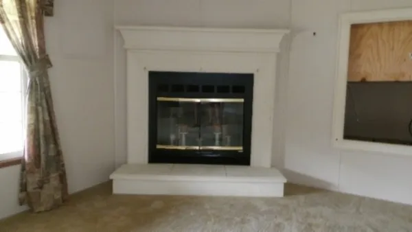 a living room with a fireplace