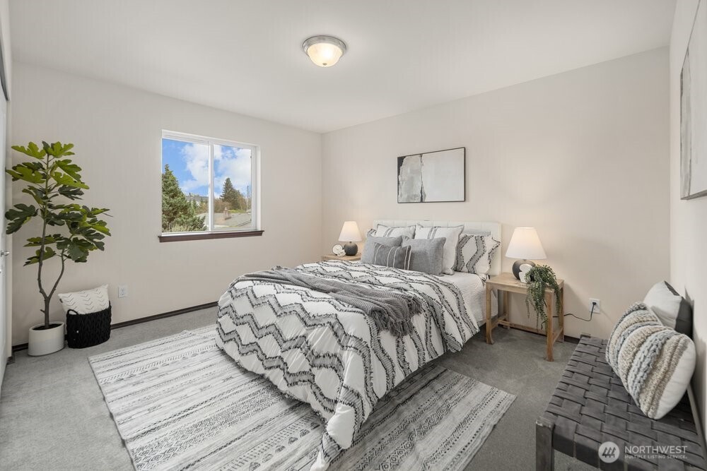 1152 Johnson Street Monroe, WA 98272 - Photo 26 of 38 a bedroom with a two bed and a potted plant