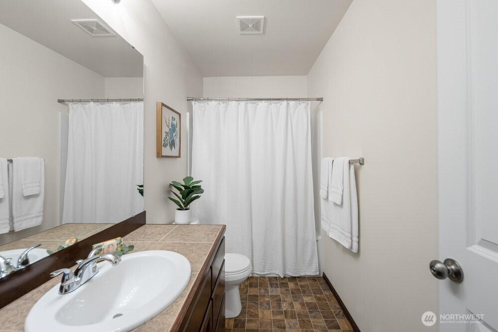 1152 Johnson Street Monroe, WA 98272 - Photo 27 of 38 a bathroom with a sink and a mirror