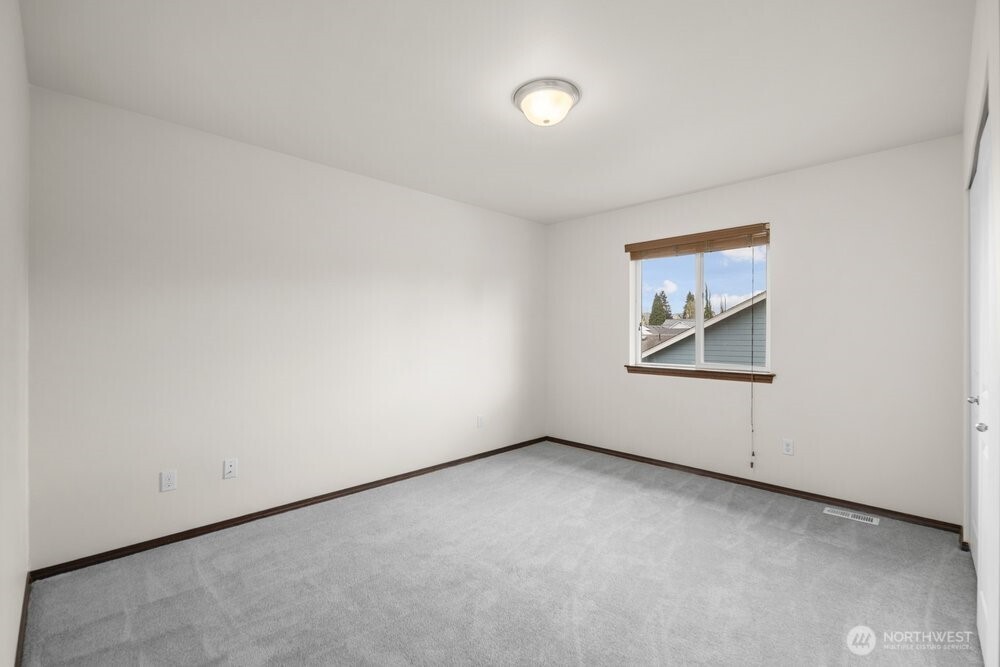 1152 Johnson Street Monroe, WA 98272 - Photo 28 of 38 an empty room with windows