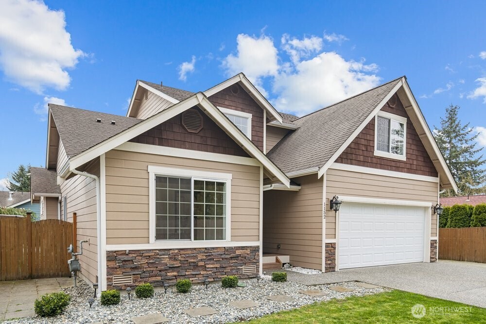 1152 Johnson Street Monroe, WA 98272 - Photo 34 of 38 a front view of a house with garden
