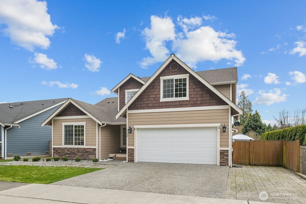 1152 Johnson Street Monroe, WA 98272 - Photo 35 of 38 a front view of a house with a yard and garage