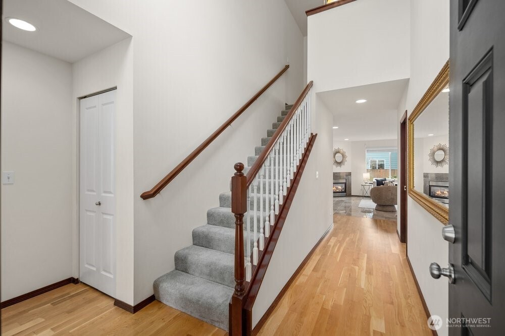 1152 Johnson Street Monroe, WA 98272 - Photo 5 of 38 a view of a hallway with wooden floor and staircase