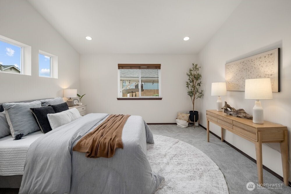 1152 Johnson Street Monroe, WA 98272 - Photo 8 of 38 a bedroom with a bed and a couch