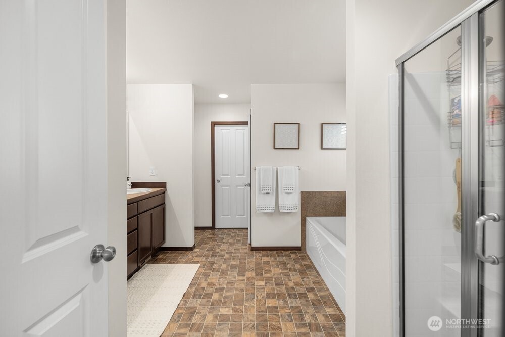 1152 Johnson Street Monroe, WA 98272 - Photo 10 of 38 a bathroom with a tub and shower