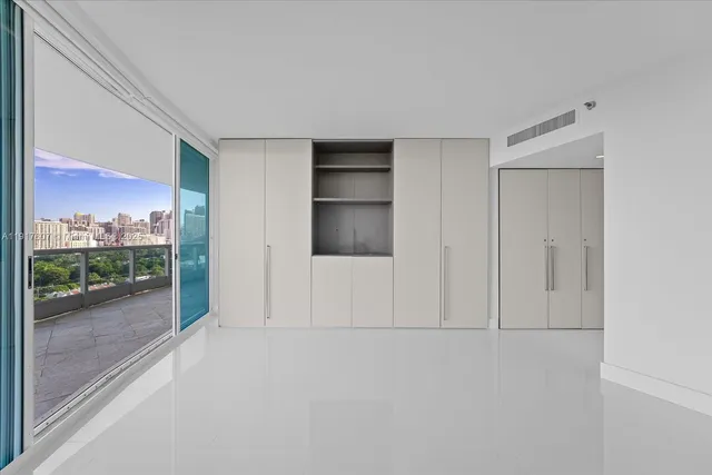 wooden floor and window in an empty room