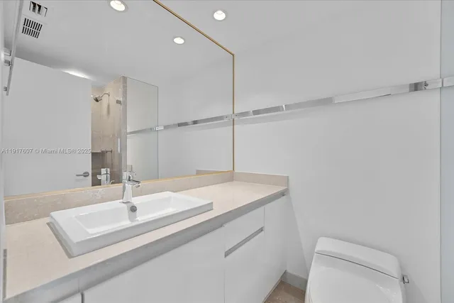 a bathroom with a sink and a toilet