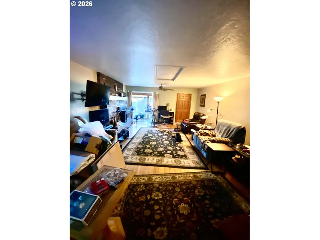 a bed room with furniture and a painting