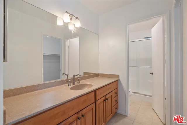 a bathroom with a sink a vanity and a mirror