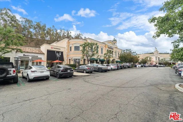 a view of cars parked in front of a building