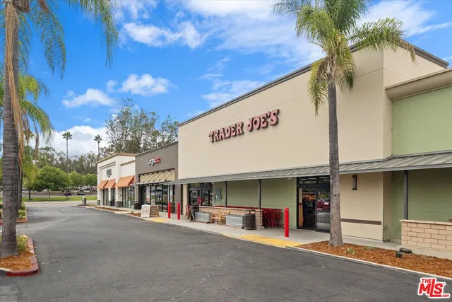 a view of a street with stores