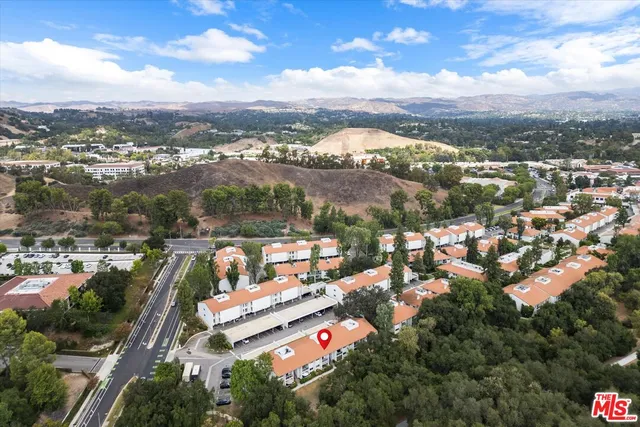 an aerial view of city and lake