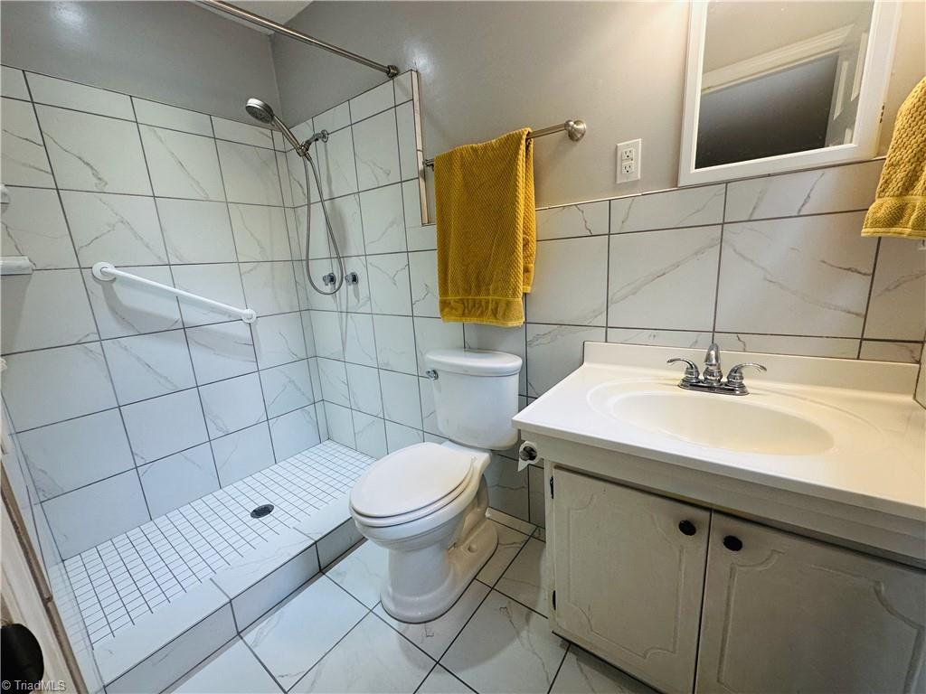 4261 Witherow Road Winston-Salem, NC 27106 - Photo 18 of 40 Primary bath with tiled floor and shower