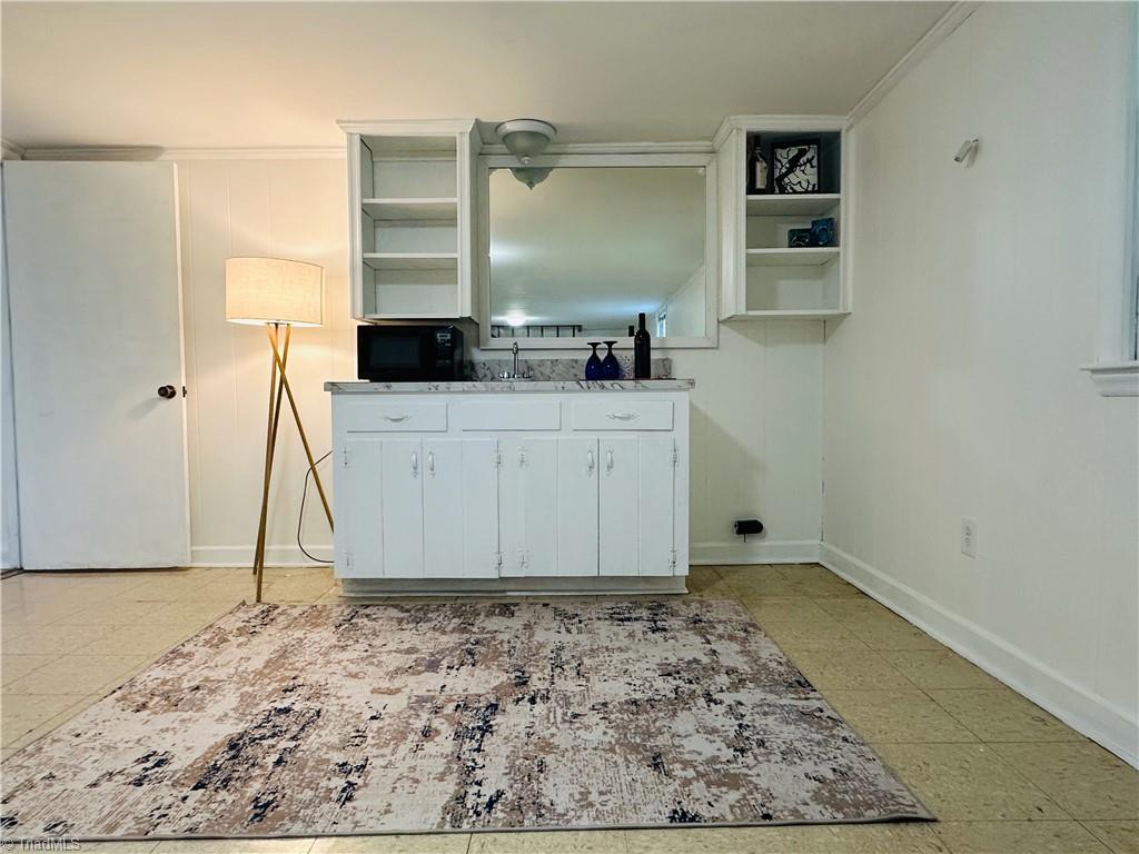 4261 Witherow Road Winston-Salem, NC 27106 - Photo 29 of 40 Basement kitchenette area. Extra bedroom to the left