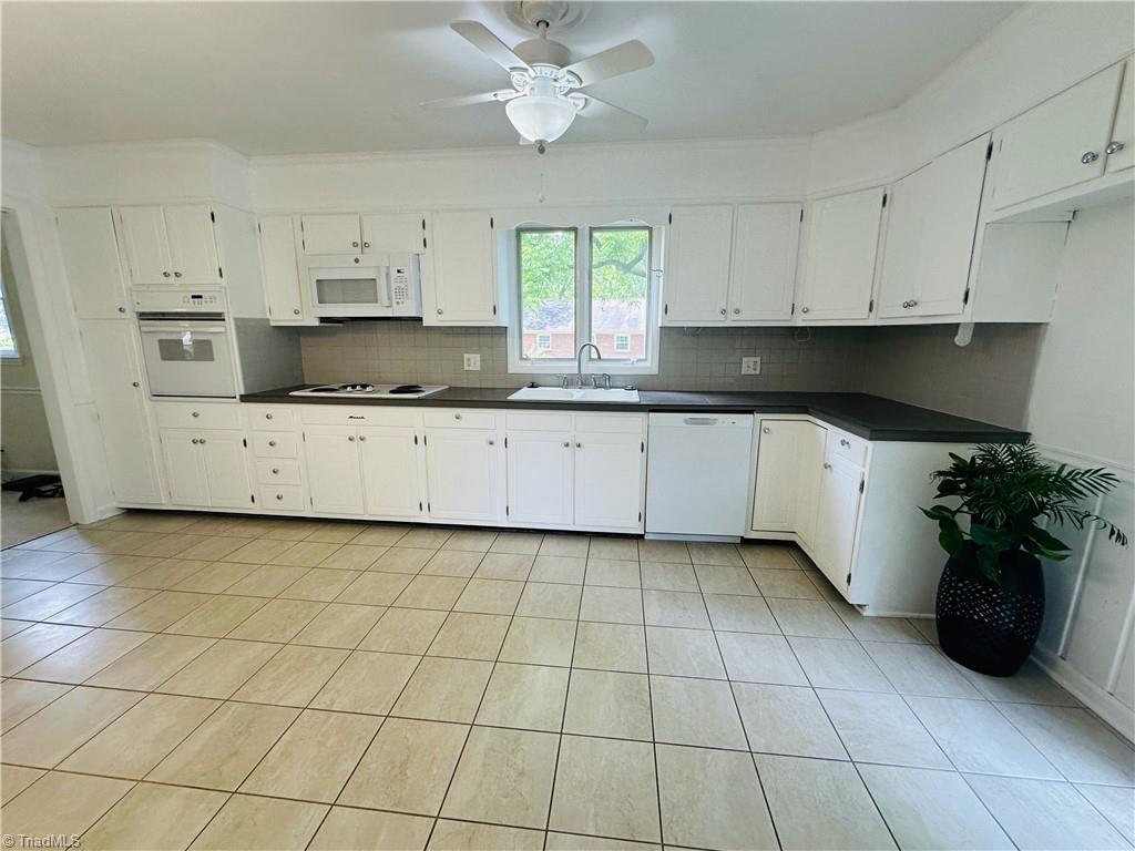 4261 Witherow Road Winston-Salem, NC 27106 - Photo 7 of 40 Tile flooring in kitchen