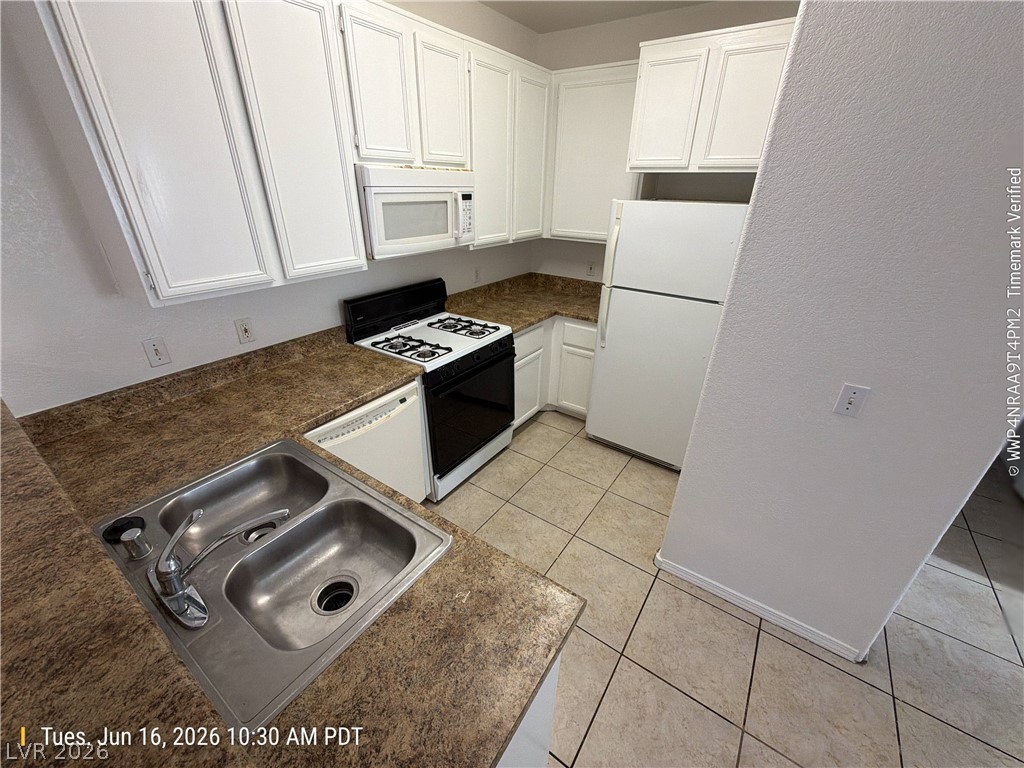 4730 East Craig Road, Unit 1124 Las Vegas, NV 89115 - Photo 8 of 22 A well-appointed kitchen features ample cabinetry, practical appliances, and durable countertops.