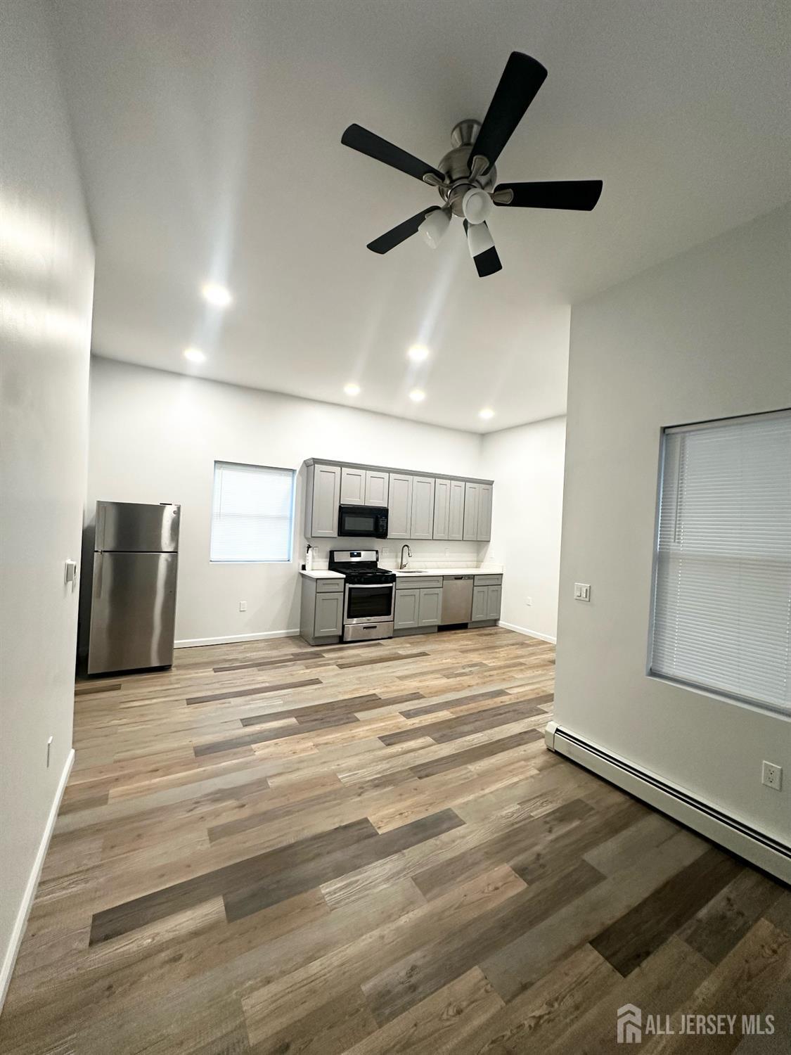 55 Cutters Dock Road, Unit B Woodbridge, NJ 07095 - Photo 7 of 13 a view of a room with a sink and a refrigerator