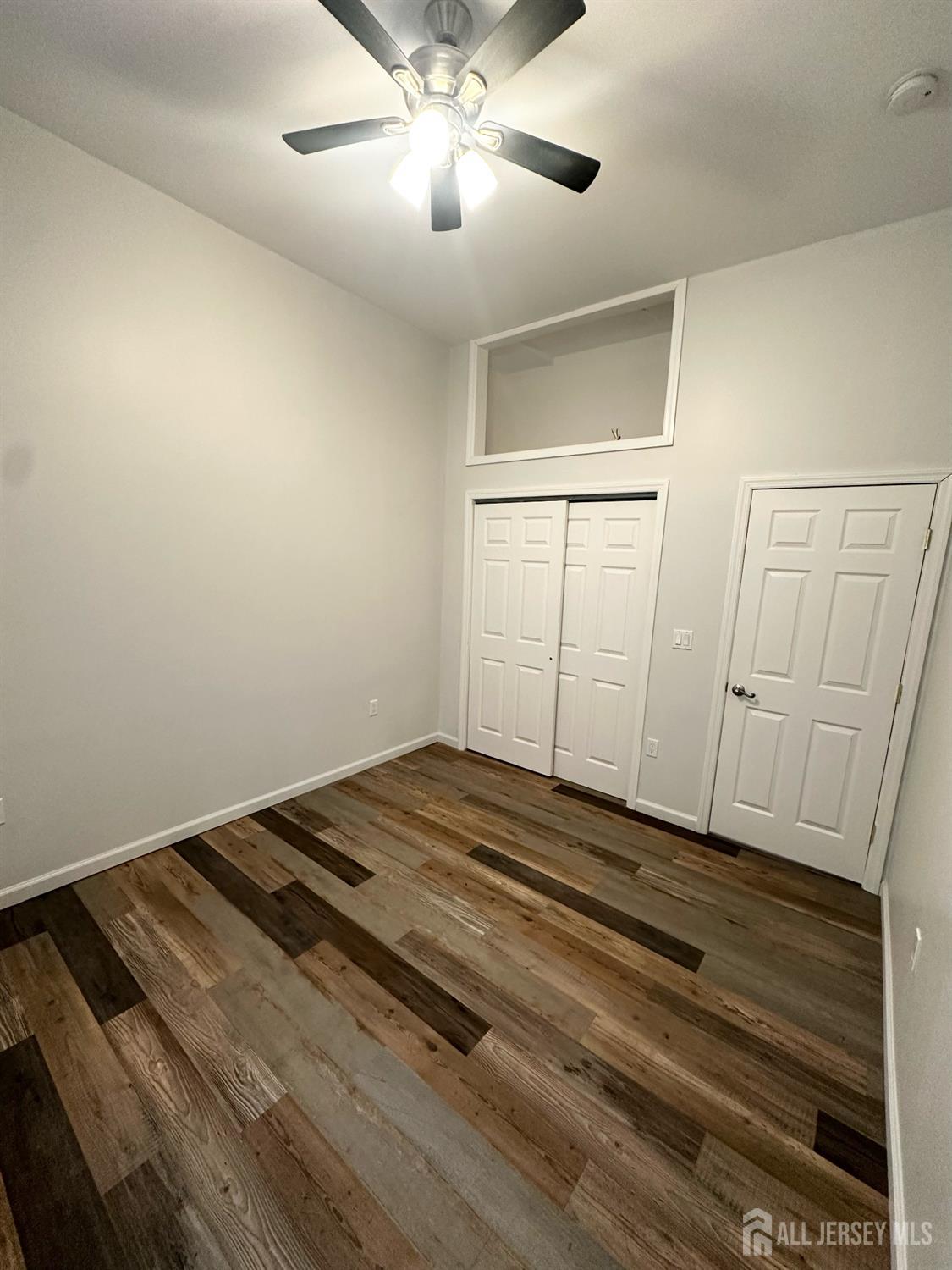 55 Cutters Dock Road, Unit B Woodbridge, NJ 07095 - Photo 9 of 13 a view of a room with wooden floor