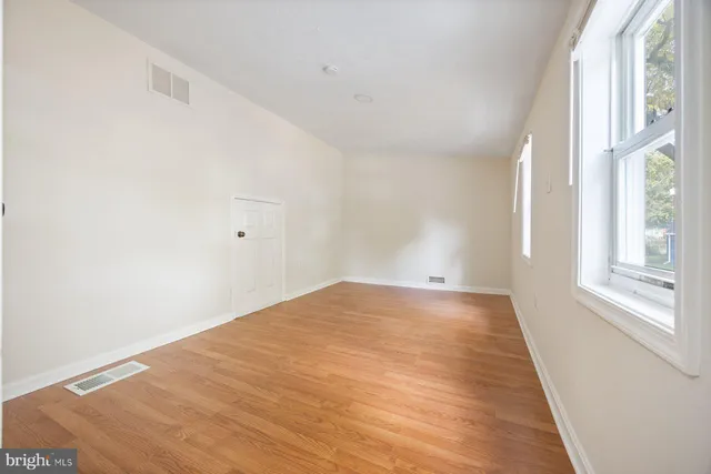 a view of an empty room and window