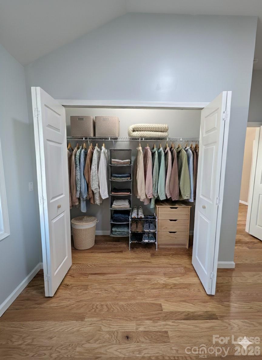 3211 Winding Trail, Unit 2 Matthews, NC 28105 - Photo 4 of 10 a view of walk in closet with clothes and shoes