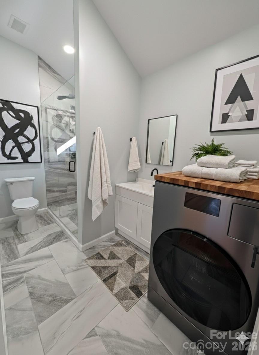 3211 Winding Trail, Unit 2 Matthews, NC 28105 - Photo 5 of 10 a utility room with sink dryer and washer