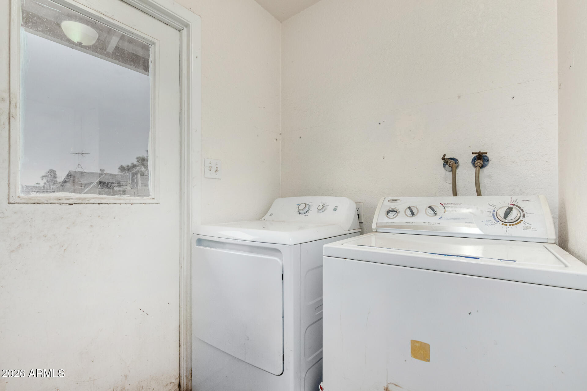 7522 West Cheery Lynn Road Phoenix, AZ 85033 - Photo 12 of 14 a utility room with dryer and washer