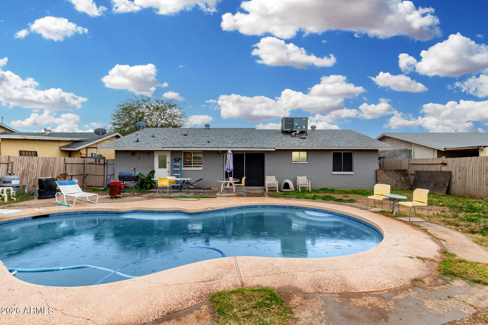 7522 West Cheery Lynn Road Phoenix, AZ 85033 - Photo 13 of 14 a view of a house with swimming pool and sitting area