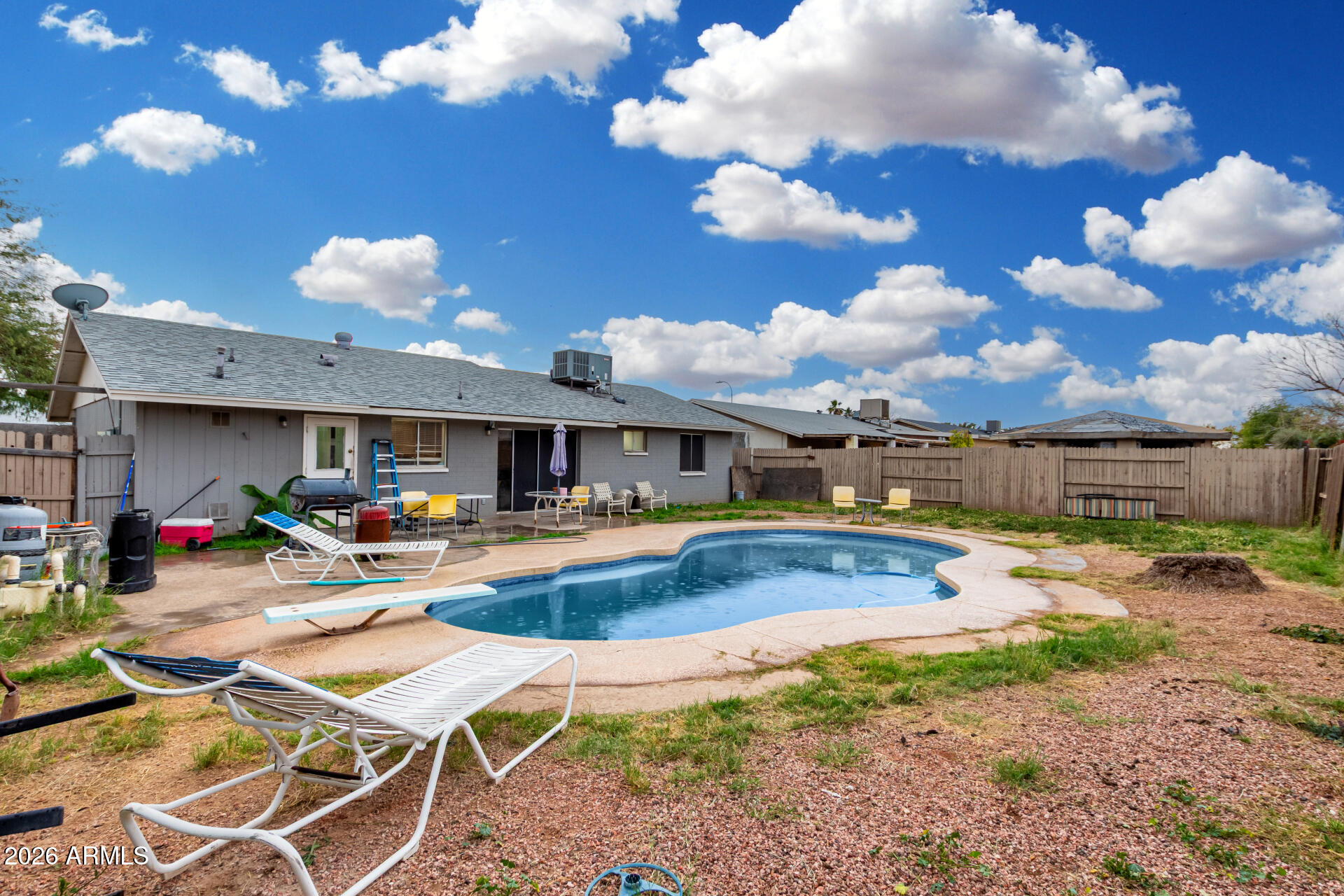 7522 West Cheery Lynn Road Phoenix, AZ 85033 - Photo 14 of 14 a view of a swimming pool with a table and chairs in the patio